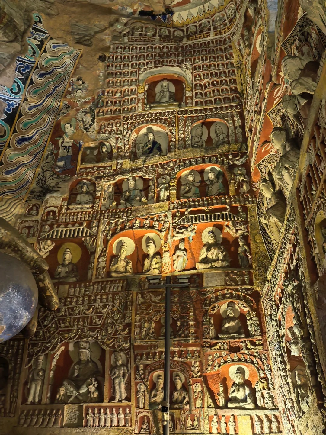 Narrative carvings and sculpted figures cover the stone walls like an ancient visual archive.